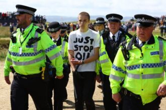 Just Stop Oil protesters set off orange flare at British Open